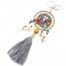 Porte-Cles-Bijou-de-Sac-Cercle-Feutrine-Buffle-Metal-Cauris-et-Pompon-Gris