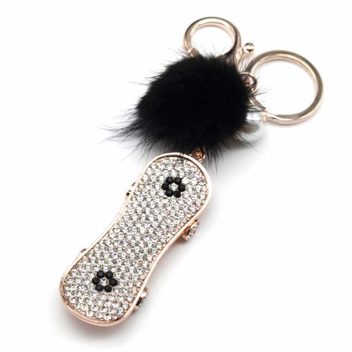 Porte-Cles-Bijou-de-Sac-Skate-Strass-Or-Rose-avec-Pompon-Noir-et-Perle