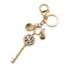 Porte-Cles-Bijou-de-Sac-Cle-Symbole-Peace-Motif-Leopard-Beige-et-Charms-Metal-Dore