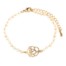 Bracelet-Mini-Perles-Beige-avec-Charm-Fleur-Ajouree-Metal-Dore