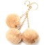Porte-Cles-Bijou-de-Sac-Triple-Pompons-Fourrure-Beige-et-Chaines-Metal-Dore