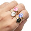 Bague-Fine-Ondulee-Acier-Dore-avec-Ovale-Email-Motif-Flamant-Rose