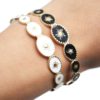 Bracelet-Jonc-Ouvert-avec-Ovales-Email-Motif-Soleil-et-Contour-Acier-Dore