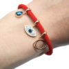 Bracelet-Cordon-Rouge-avec-Charm-Oeil-Strass-Contour-Acier-Or-Rose-et-Pierre-Goutte-Bleue
