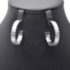 Boucles-dOreilles-Creoles-Ondulees-Motif-Soleils-et-Points-Acier-Argente